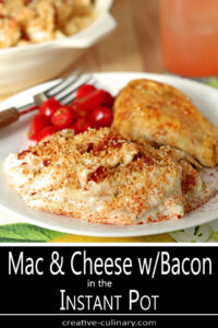 White Plate with Macaroni and Cheese with Bacon Served with Chicken Thigh and Sliced Fresh Tomatoes