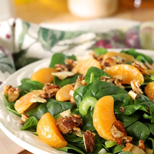 Mandarin Orange Salad with Candied Almonds Served on White Plate