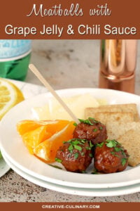 Appetizer Plate of Meatballs, Fruit, Crackers, and Cheese