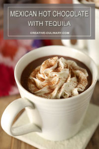 Mexican Hot Chocolate with Tequila Served in a White Mug with Whipped Cream on Top