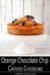 Orange Chocolate Chip Cannoli Cheesecake on a White Cake Plate Topped with Cannoli