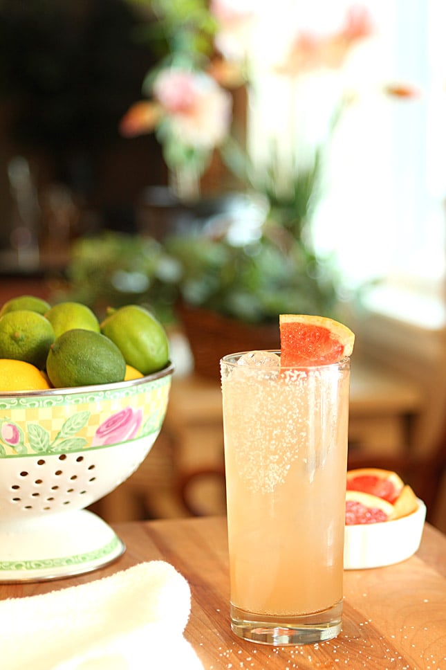 The Paloma Cocktail on a Table with a Basket of Lemons and Limes