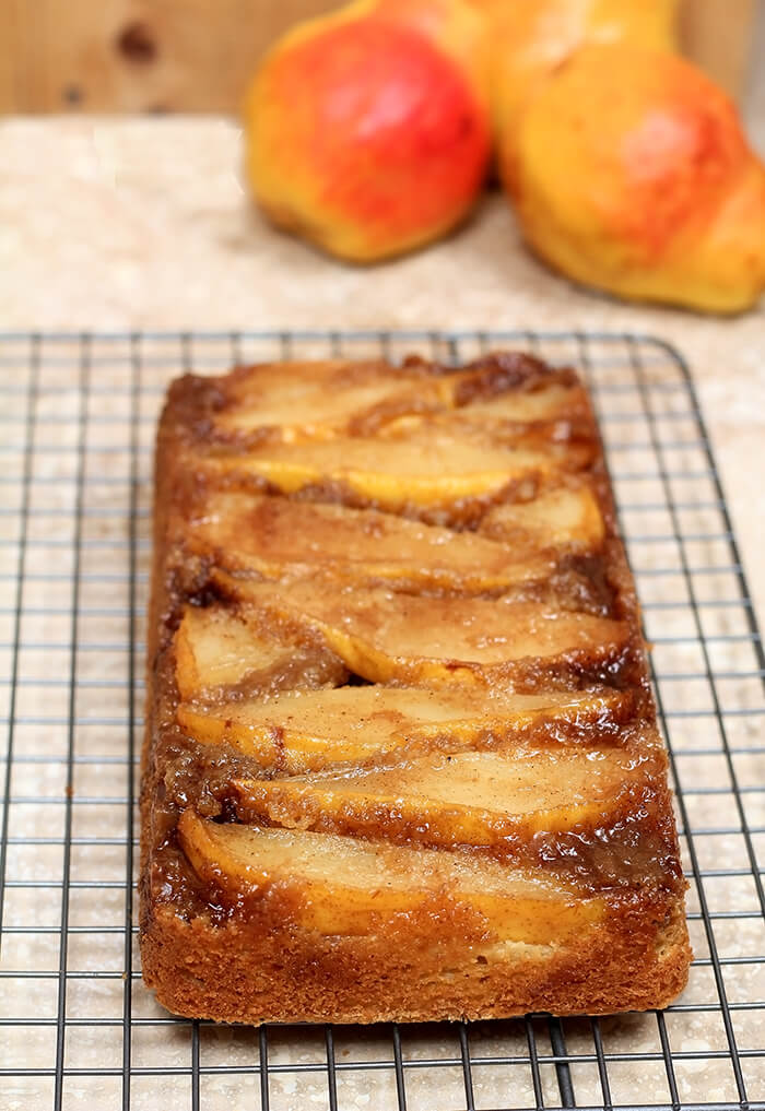 Upside Down Pear Crunch Coffee Cake on a Wire Cooling Rack