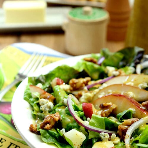 Salad with Greens, Pear, Walnuts, and Gorgonzola Cheese in White Salad Bowl