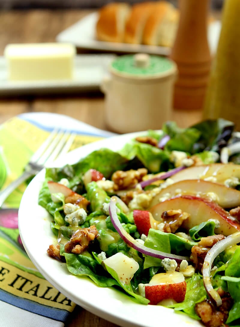 Salad with Greens, Pear, Walnuts, and Gorgonzola Cheese in White Salad Bowl