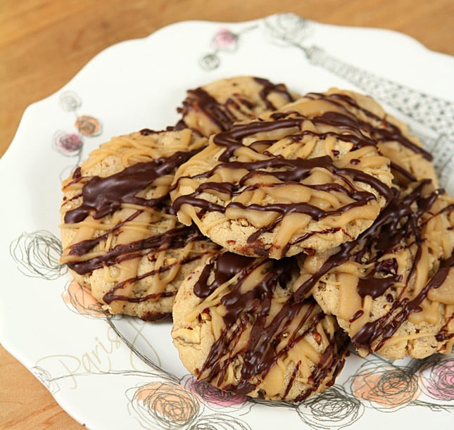 Pecan Cookies with Penuche and Drizzled Chocolate are Served on a Decorated White Plate