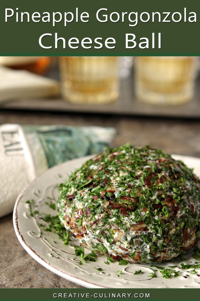 Pineapple and Gorgonzola Cheese combined with dried Cranberries in a cheese ball covered with pecans and parsley.