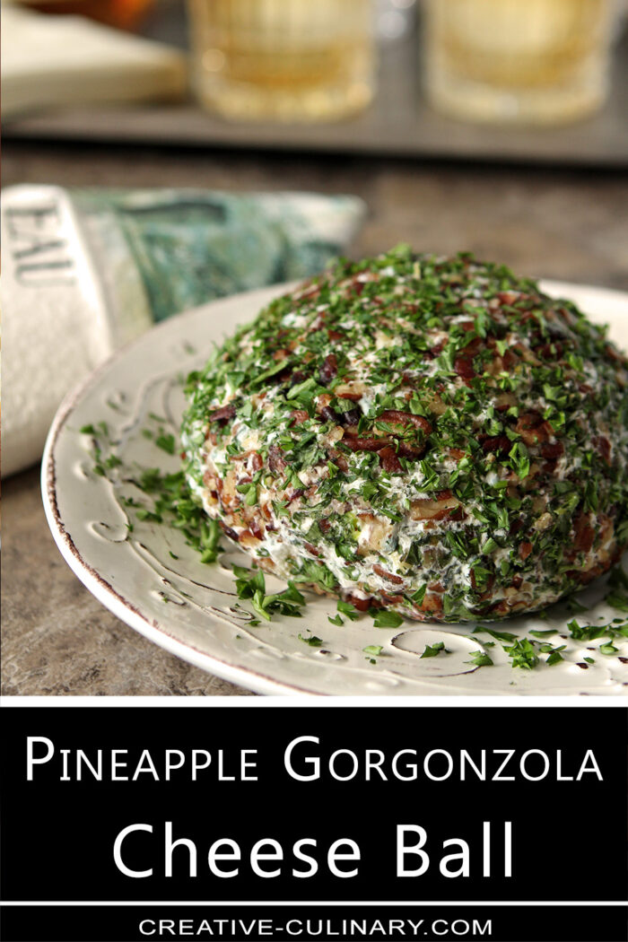 Pineapple and Gorgonzola Cheese combined with dried Cranberries in a cheese ball covered with pecans and parsley.