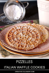 Pizzelles - Italian Waffle Cookies Sprinkled with Powdered Sugar and Served on Pink Plate