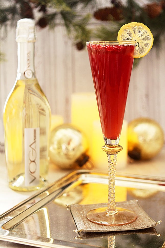 Pomegranate and Ginger Sparkling Cocktail in a Champagne Glass on a Silver Serving Tray