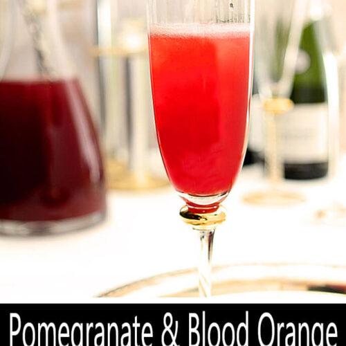 Pomegranate and Blood Orange Mimosa Cocktail in a Glass with Prosecco Being Poured PIN