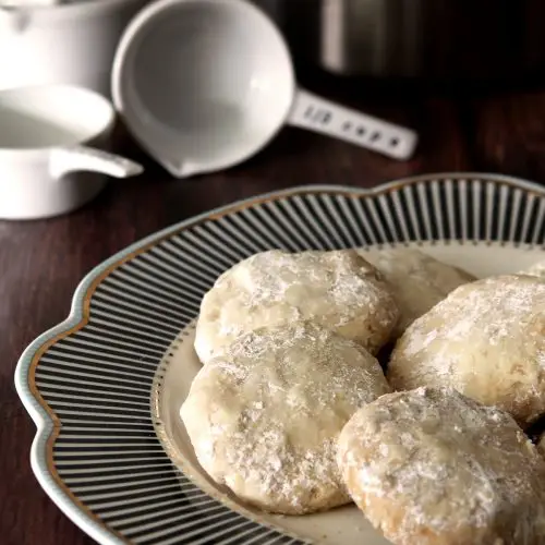 Potato Chip Cookies with Toasted Pecans on Black and White Plate.