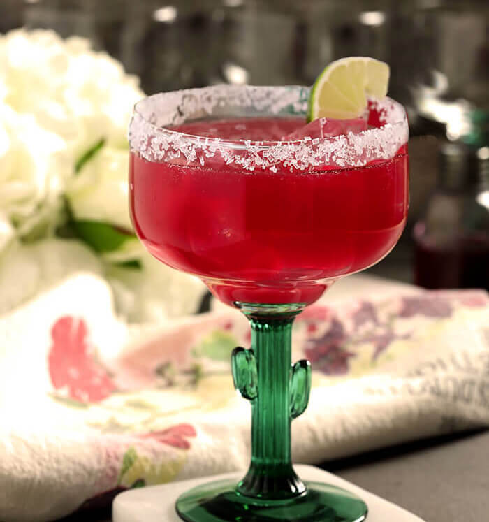 Prickly Pear Cactus Margarita in a Margarita Glass with a Cactus Stem