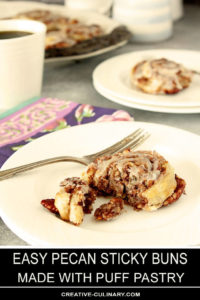 Puff Pastry Pecan Sticky Buns with Maple and Bourbon Glaze on a White Plate with Fork