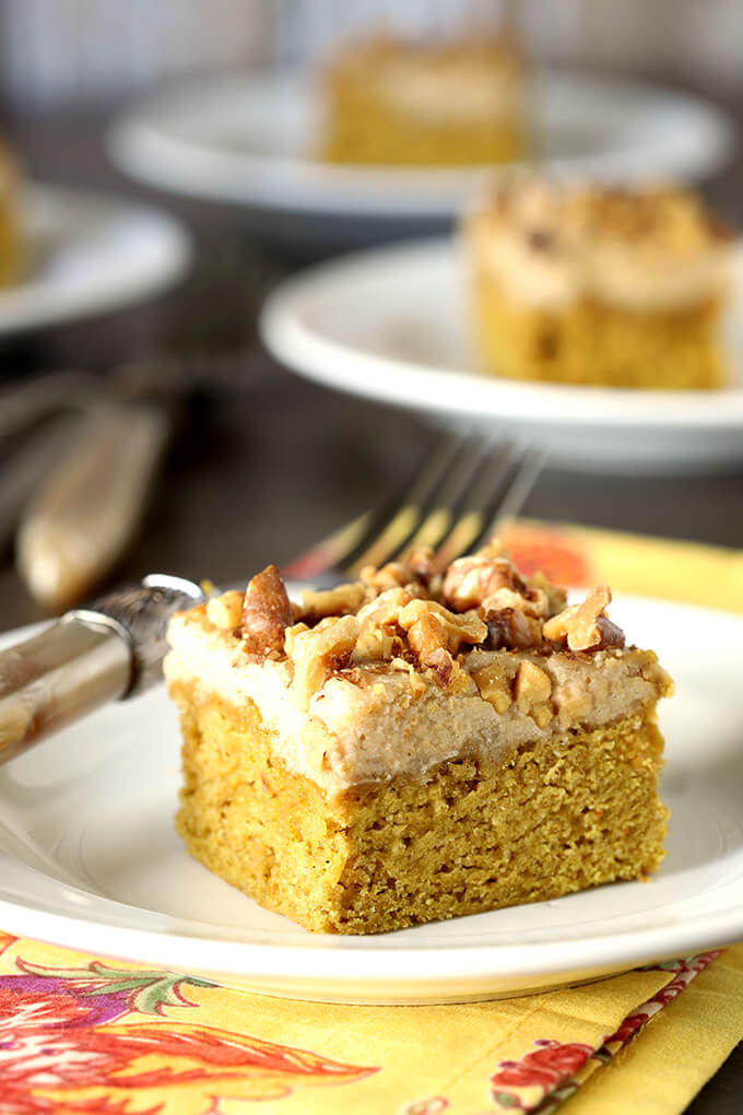 Pumpkin Bars with Maple Frosting and Toasted Walnuts on White Plate with a Fork