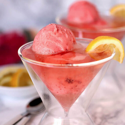 Raspberry Lemonade Wine with Sherbet Served in a Martini Glass and Garnished with Lemon and Served in a Martini Glass