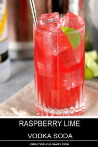 Raspberry Lime Vodka in Tall Glass with Lime Wedge