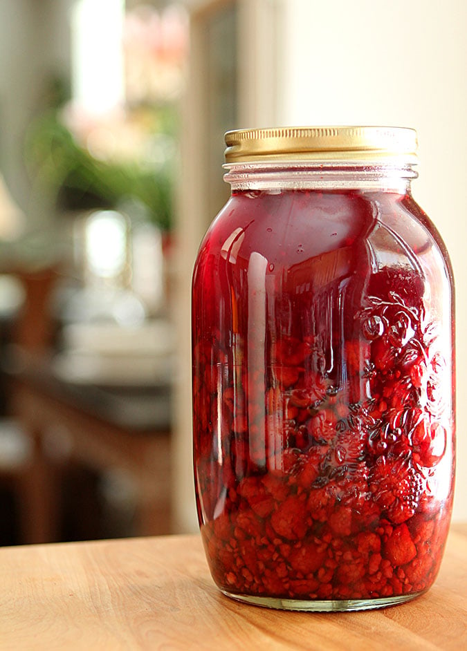 Homemade Raspberry Liqueur In a Large Mason Jar