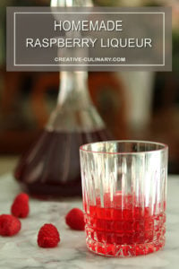 Homemade Raspberry Liqueur Served Served in a Crystal Highball Glass