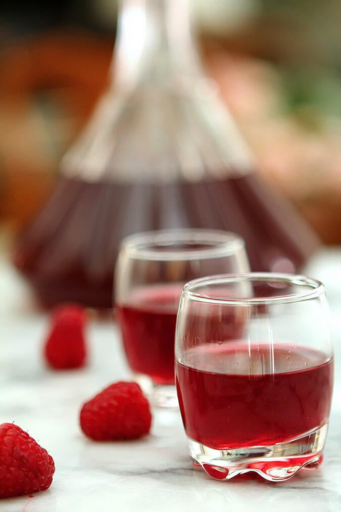 Homemade Raspberry Liqueur Served in small apertif glasses.