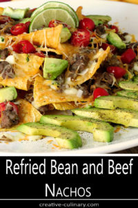 White Serving Plate with Refried Bean and Beef Nachos with Avocado Slices