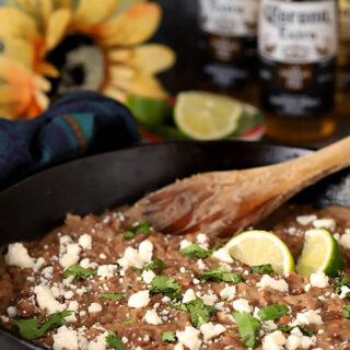 Cast Iron Skillet with The Best Re-Fried Beans with Bacon