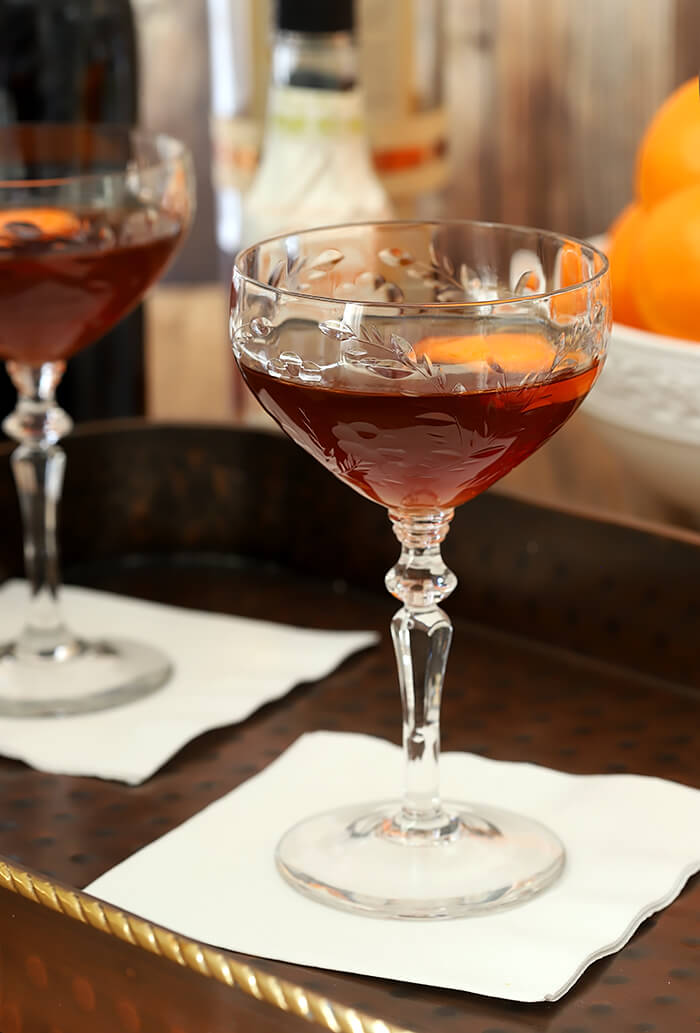 Serve the Revolver Cocktail in a Coupe Glass with a Rounded Bottom