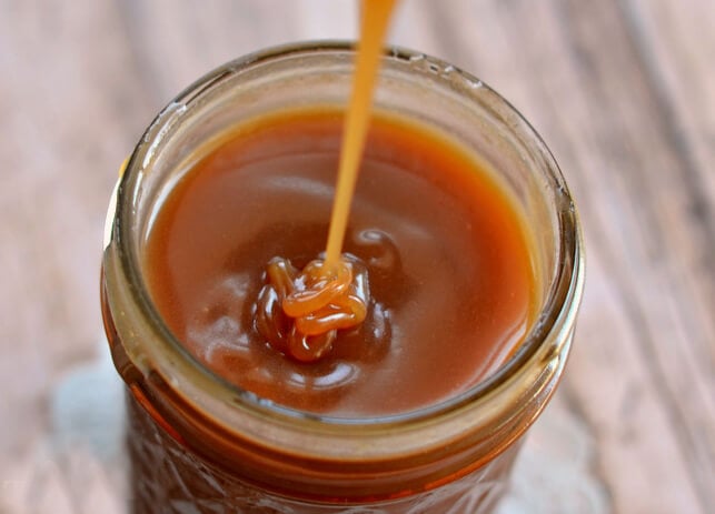 Rum and Cinnamon Caramel Sauce Poured into a Jar