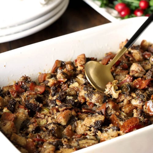 Pumpernickel Dressing with Bourbon and Pecans in a White Serving Bowl