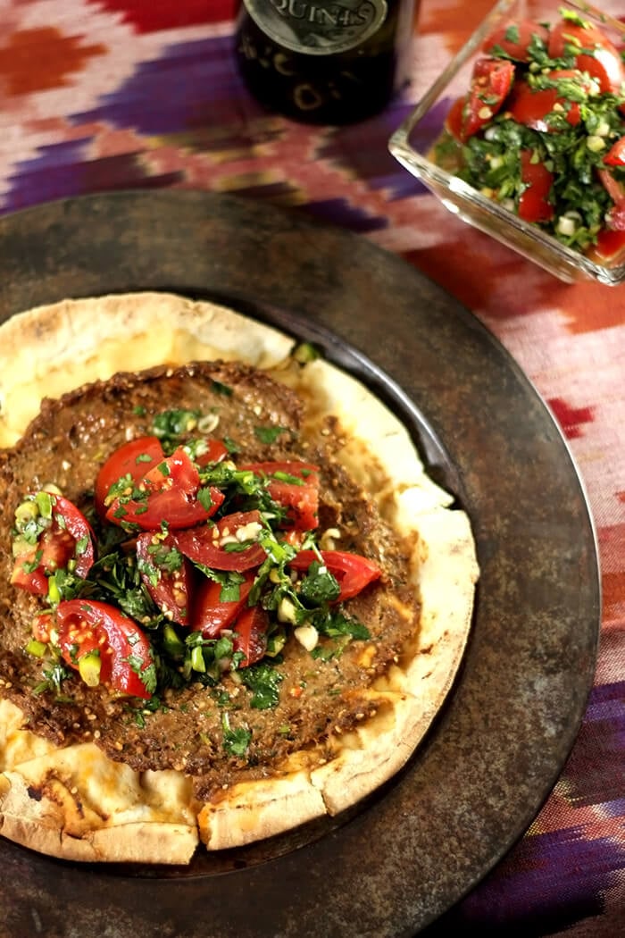 Ground Beef Sfeeha on Pita with Tomato Salad