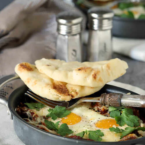 Shakshuka with Zucchini and Mushrooms Served in Skillet