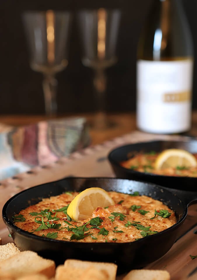 Small Cast Iron Skillets with a Shrimp Scampi and Parmesan Cheese Dip.