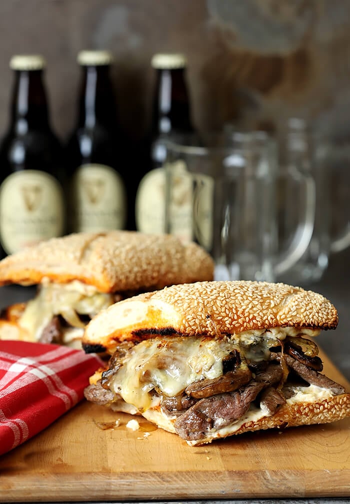 Steak and Cheese Sandwich with Caramelized Onions and Mushrooms Served on a Sesame Seed Roll