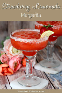 Strawberry Lemonade Margaritas Garnished with a Strawberry and Lime Wedge