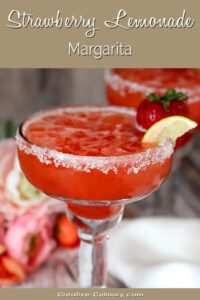 Strawberry Lemonade Margarita Garnished with a Strawberry and Lime Wedge