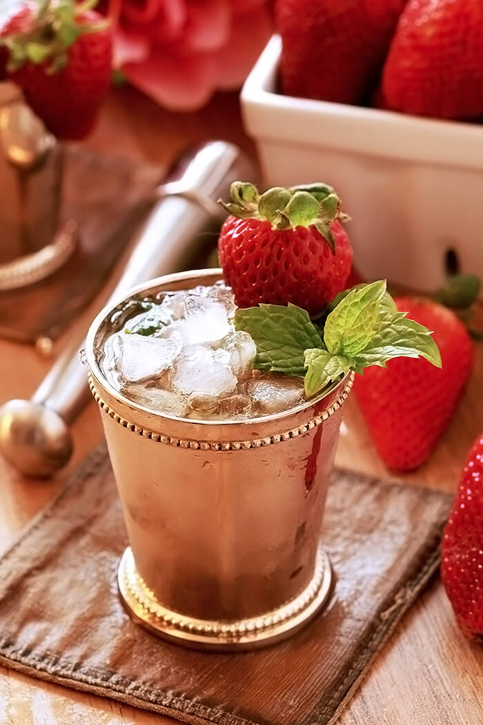 Strawberry Mint Julep Cocktail in Silver Cup with Garnish Closeup