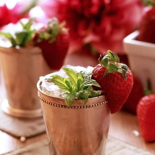 Strawberry Mint Julep Cocktail in Silver Cup with Strawberry and Mint Garnish