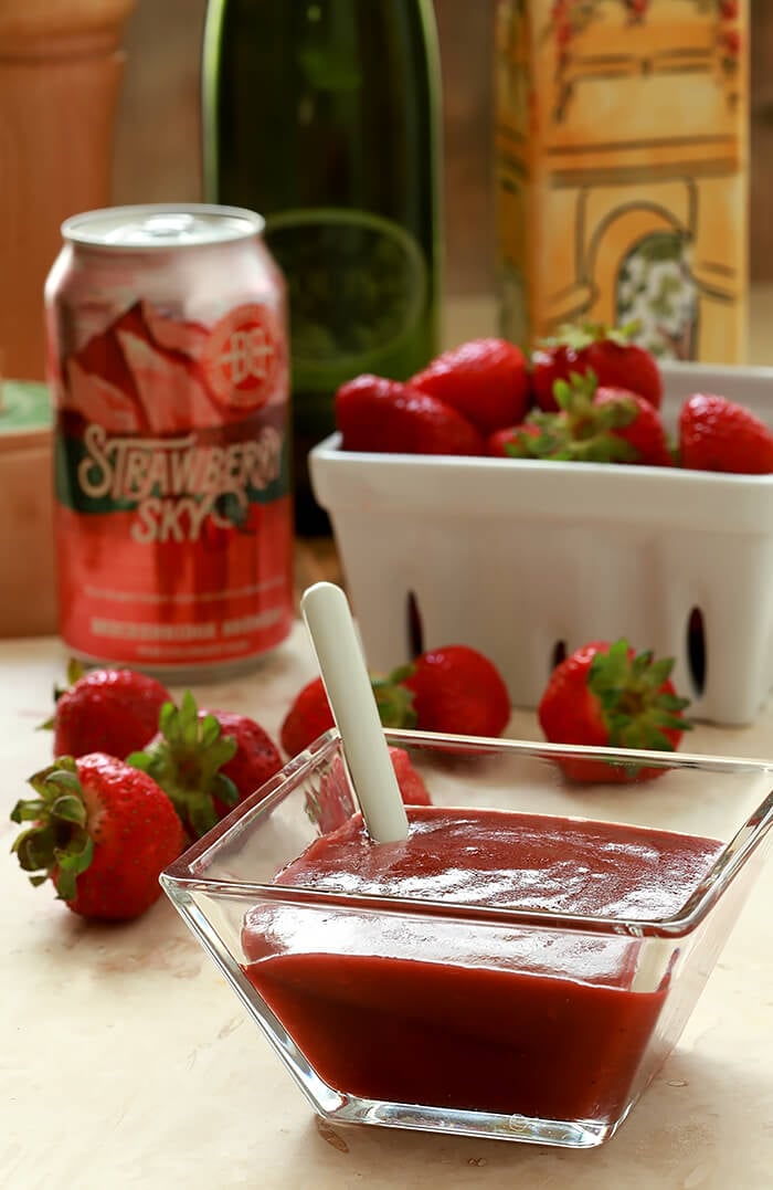 Strawberry Sky Salad Dressing in a Glass Serving Container with Can of Strawberry Sky Beer