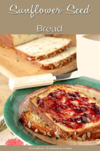 Buttered Slices of Sunflower Seed Bread with Cherry Jam