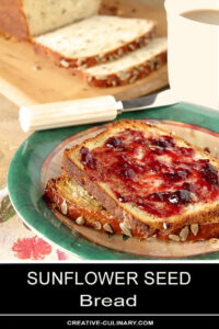 Buttered Slices of Sunflower Seed Bread with Cherry Jam