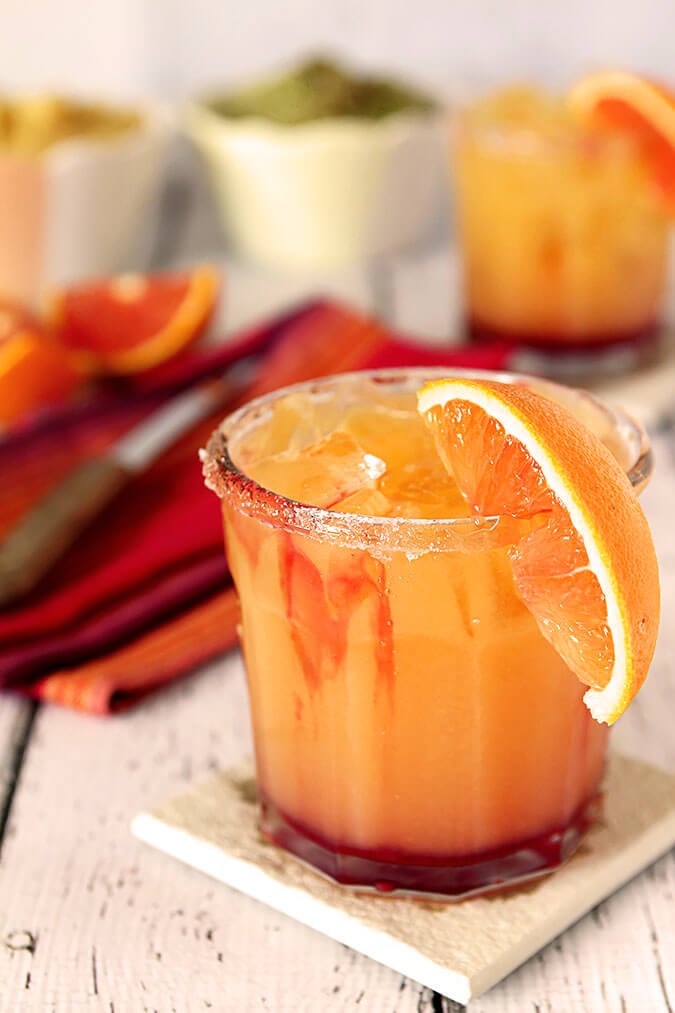 Tequila Sunrise Margarita with an Orange Section for Garnish