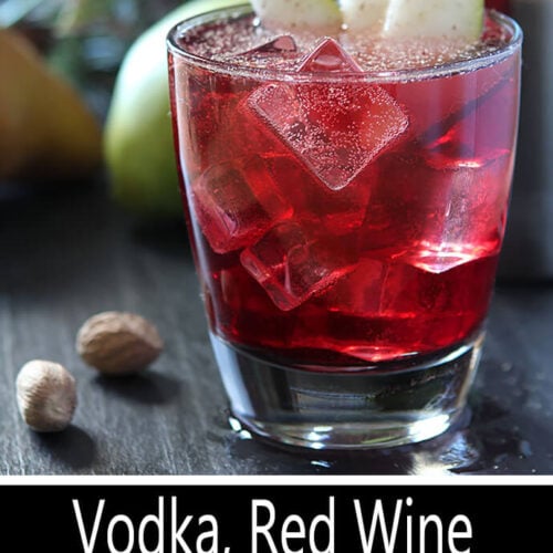 Vodka, Pear, and Red Wine Cocktail in a Lowball Glass with Pear and Nutmeg Garnish