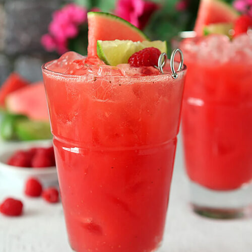 Watermelon Raspberry Cooler Cocktail with Rum Garnished with Three Fruits