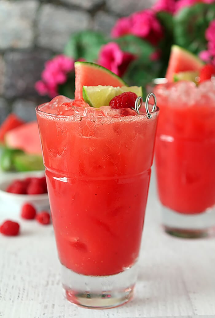 Watermelon Raspberry Cooler Cocktail with Rum Garnished with Three Fruits