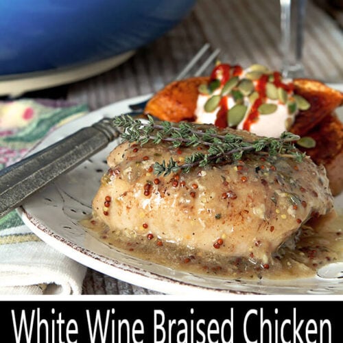 White Wine Braised Chicken with Mustard and Thyme Served on a White Plate with Butternut Squash