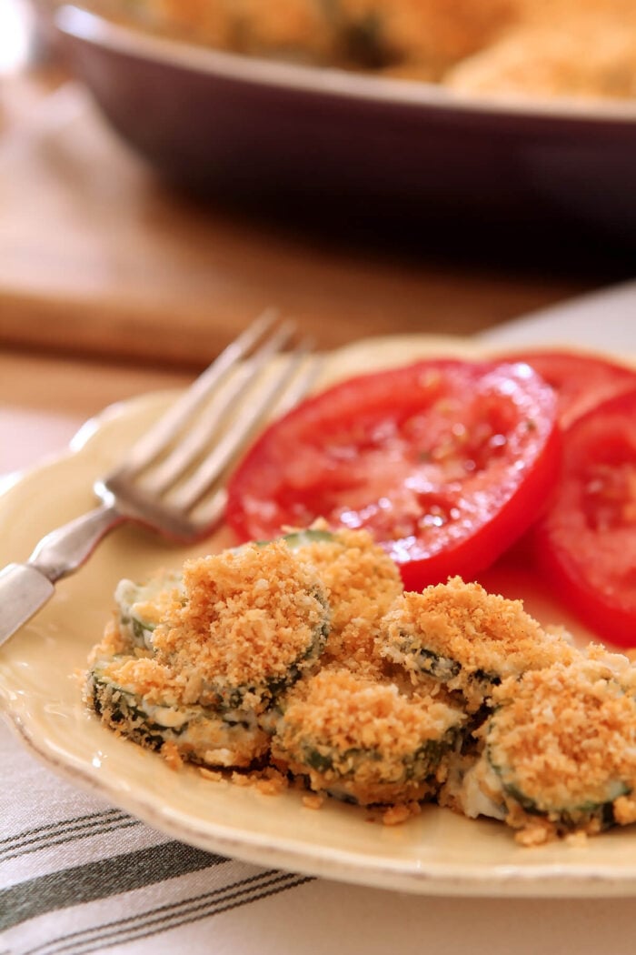 Serving of Zucchini and Cream Cheese Casserole with Sliced Garden Tomatoes